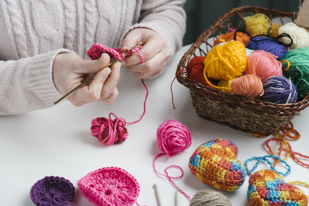 basket-of-wool-balls-and-woman-weaving.jpg